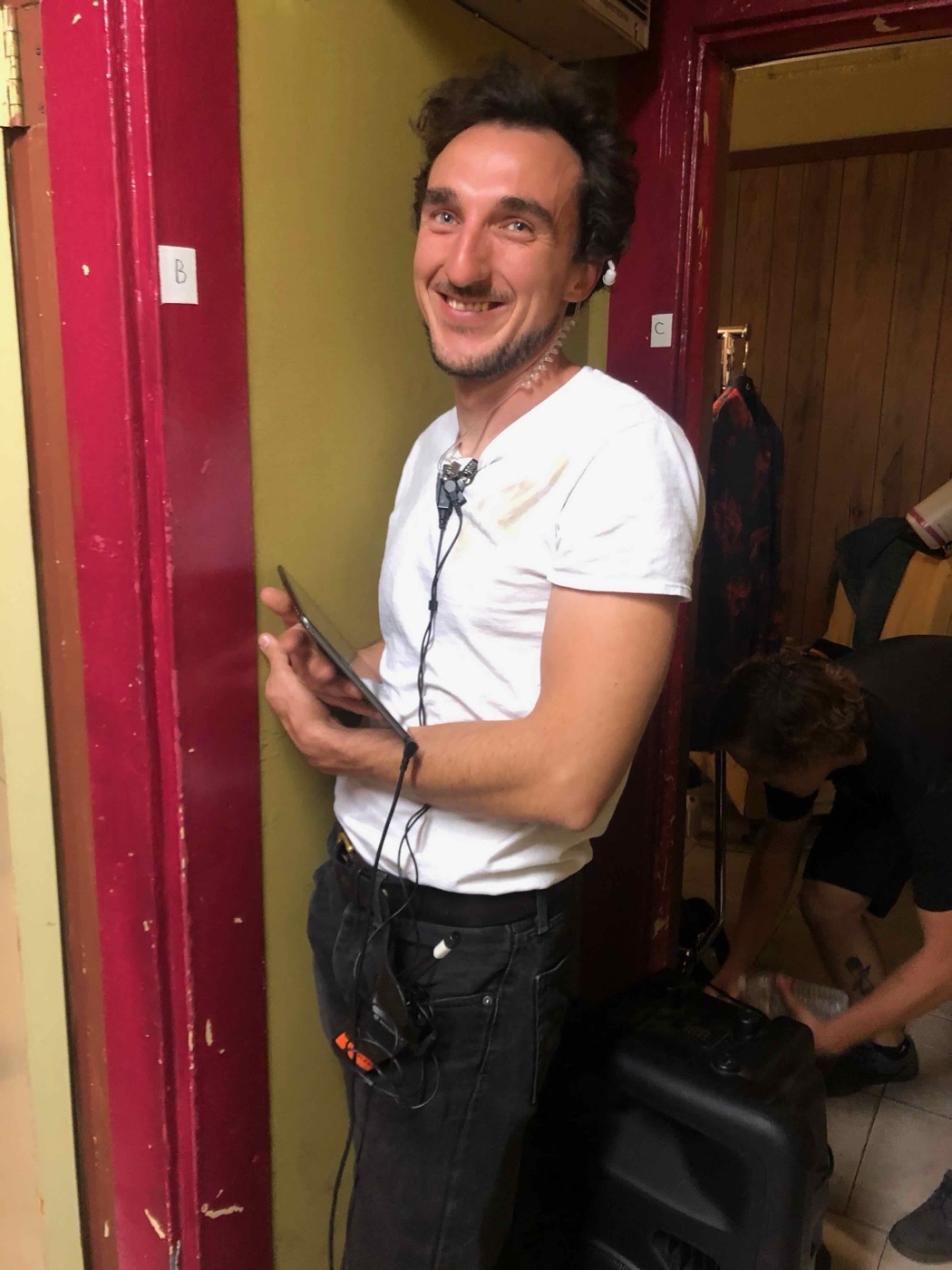 A crew member at work backstage during a shoot