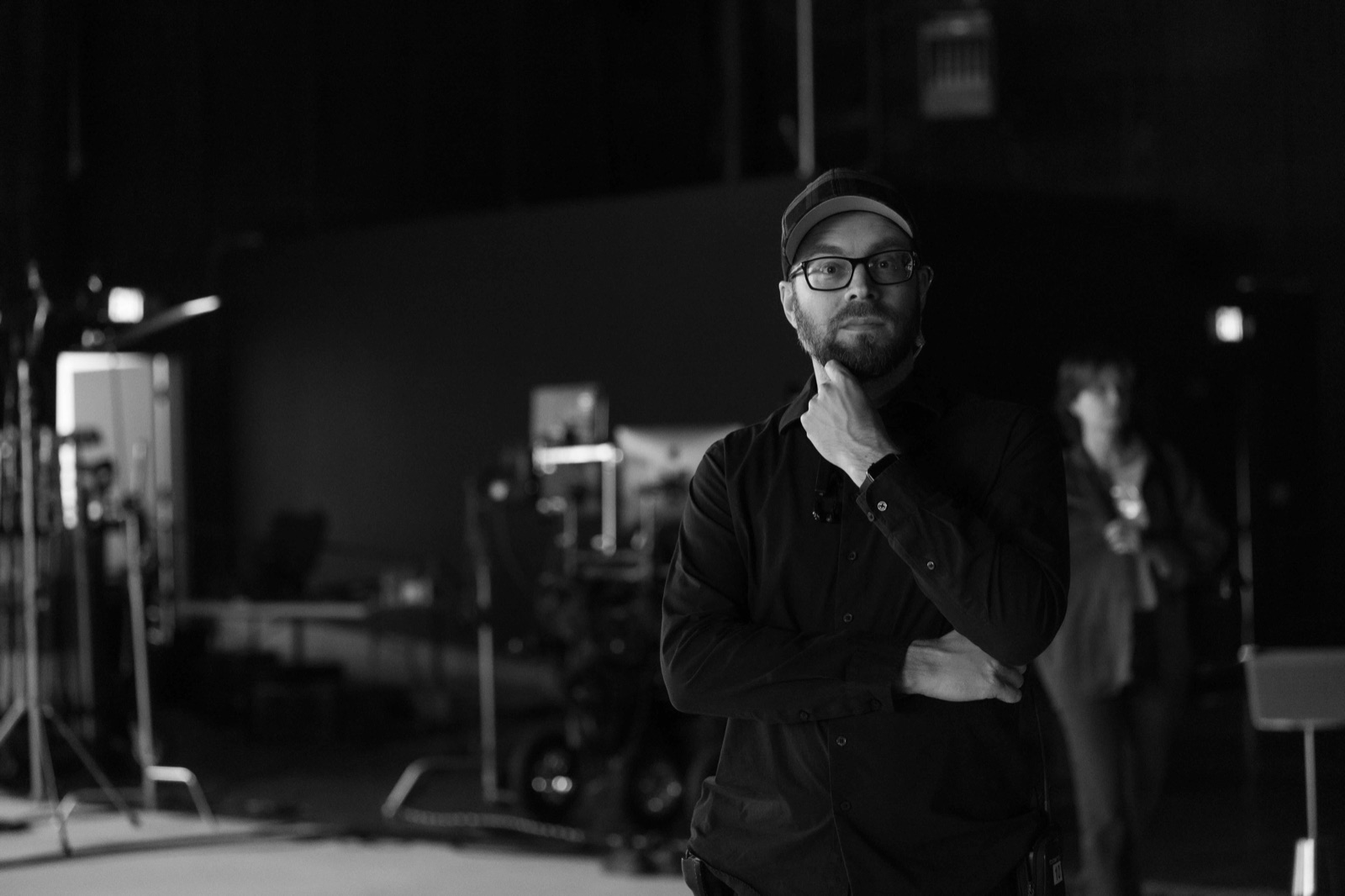 A Lodger Films crew member on a darkened production stage