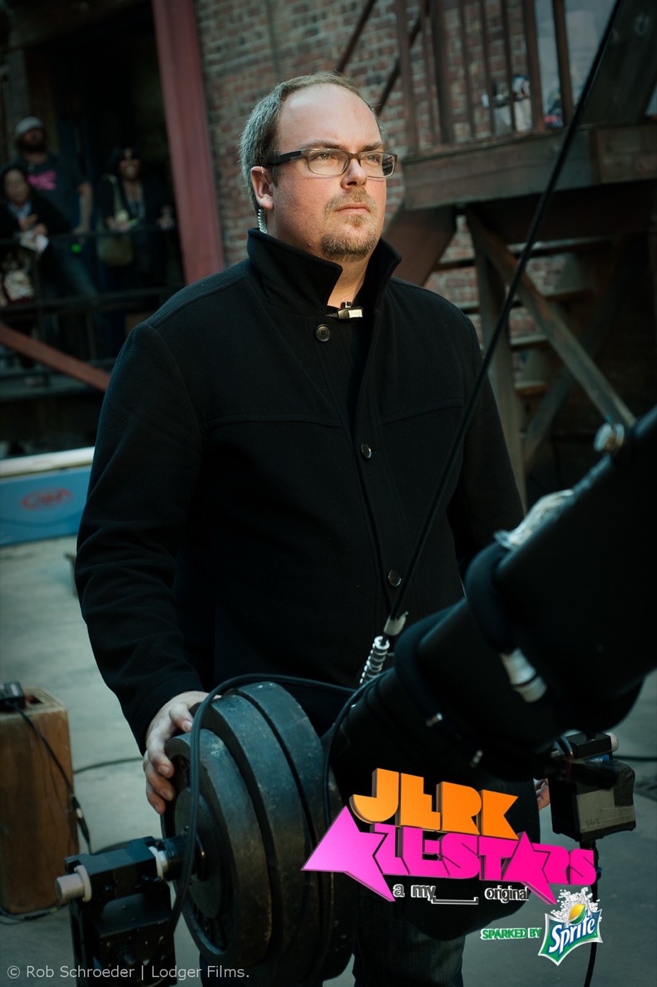 A crew member steadies a camera crane counterweight on the Jerk All-Stars shoot